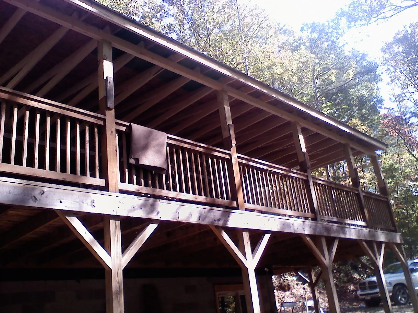Timber framing under a new elevated porch and deck — Roof Leak Repair in Wise River by Roofing Brothers